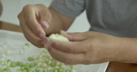 Crafting authentic Asian sweets from scratch for a traditional Thai Bua Loi Stock Footage 340875544