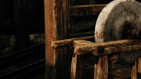 Crafting Beauty With a Rustic Grinding Stone in a Cozy Workshop Stock-Footage 344821299