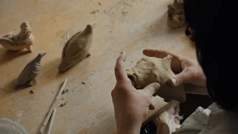 Crafting a big clay bird Stock Footage 218604493
