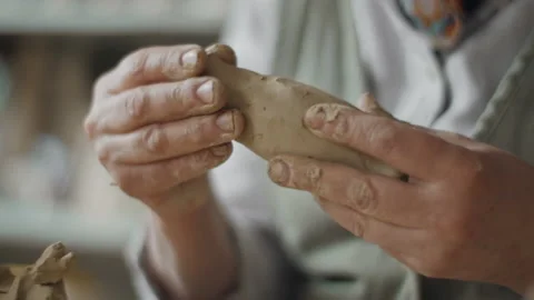 Crafting a clay whistle in slow motion Video stock 218604341