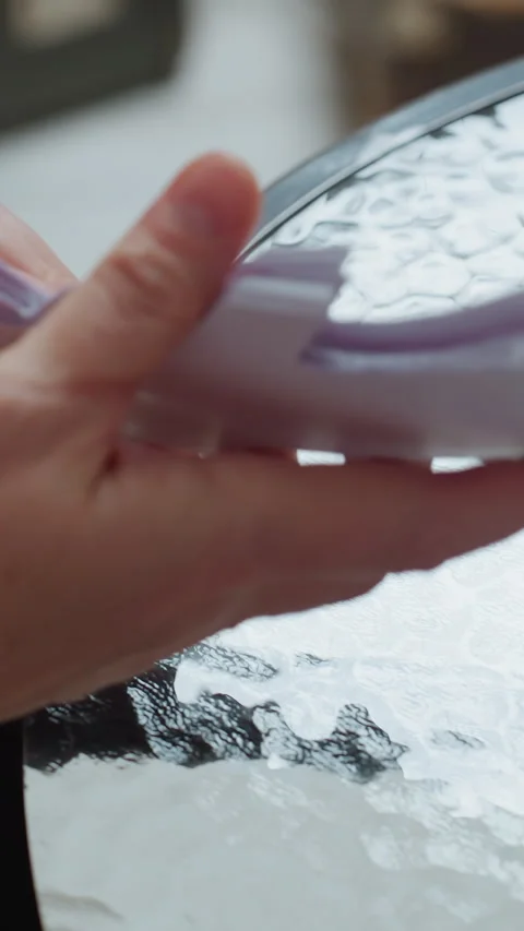 Crafting delicate decoration, Hands fold paper into snowflake, Artisan hands Stock Footage 326823957