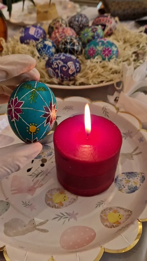 Crafting Easter egg using traditional Ukrainian pysanka technique with beeswax Stock Footage 306087065