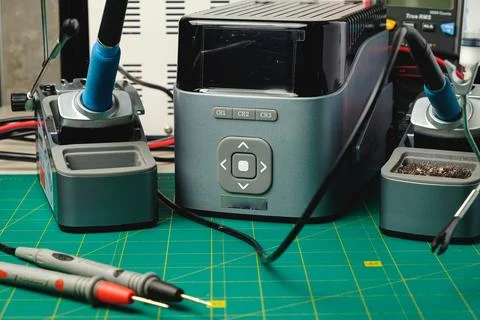 Crafting electronics with precision tools in a bright workshop setting Stock Photos