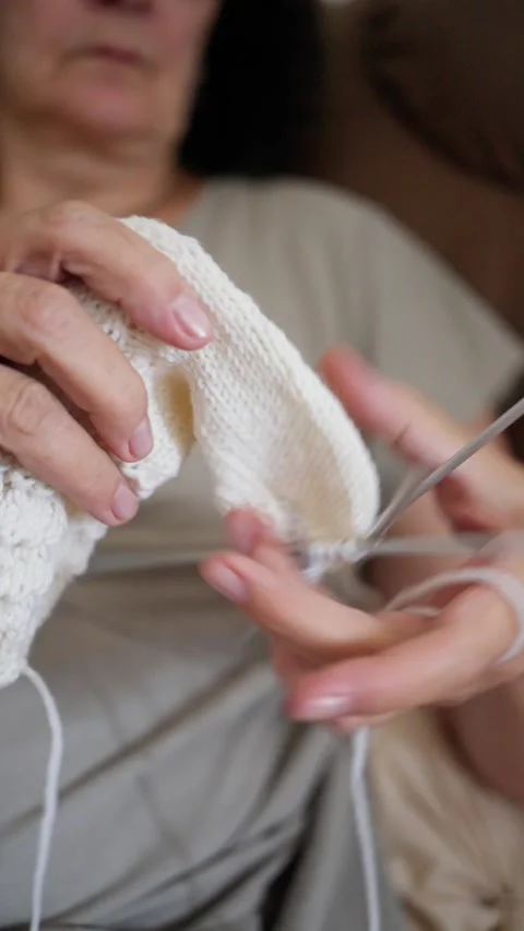 Crafting Elegance The Art of Knitting a Cozy and Soft White Sock for Ultimate Video stock 314894016