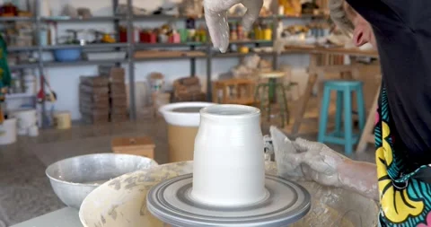 Crafting Elegance: A skilled artisan skillfully molds Stock Footage 329307619