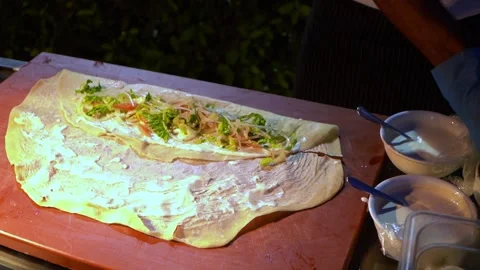 Crafting a Fresh Vegetable Wrap Stock Footage 319949945