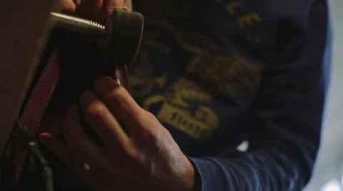 Crafting leather on a vintage machine. View from below Video stock 61033883