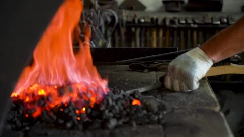 Crafting Metal: The Art of Forging with Fire, Heat, and Skill in an Engaging Stock Footage 341316594