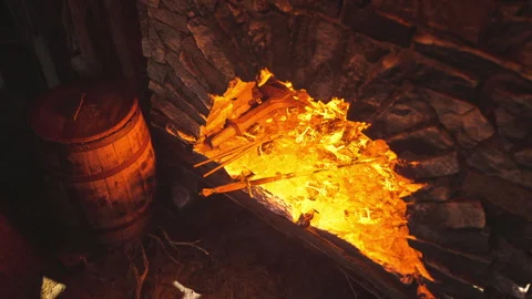 Crafting metal tools in an old forge with glowing embers and rustic elements Stock Footage 331420594