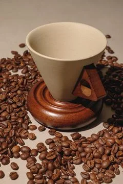 Crafting the perfect coffee: A cozy setup with beans and filter cone Stock Photos