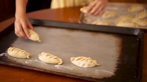 Crafting Perfection: Baking Empanadas from Scratch Stock Footage 300067106