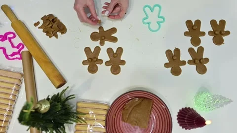 Crafting playful gingerbread men with a festive touch this Christmas season Stock Footage 344820886