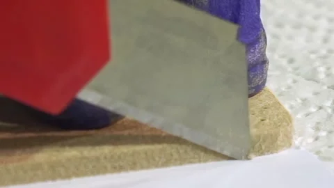 Crafting With Precision: Close-up of Cutting Techniques in Art Creation Stock Footage 340594307