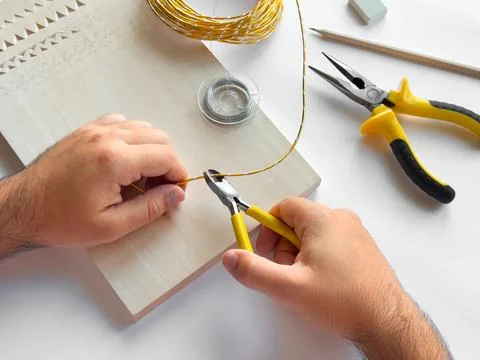 Crafting with precision. Hand tools and wire for diy projects Stock Photos