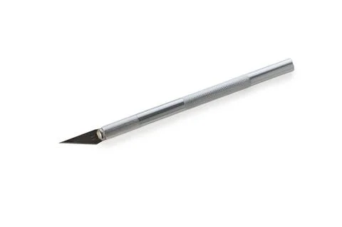 Crafting precision with a sleek cutting tool designed for detailed artistry.. Stock Photos