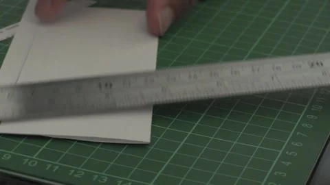 Crafting precision with tools and paper Stock Footage 323700586