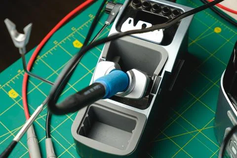 Crafting with tools at a workbench surrounded by vibrant equipment Stock Photos