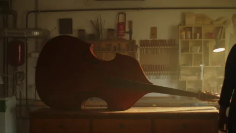 Crafting a unique bass in a luthier workshop Stock Footage 319920859