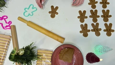 Crafting unique gingerbread men with humor during Christmas time Stock Footage 344821894