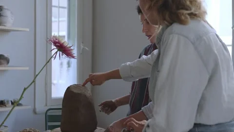 Crafting a Vase: An Intimate Moment of Creative Collaboration Between Mother and Stock Footage 262520472