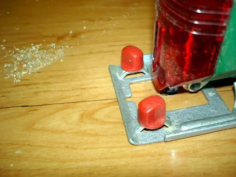 Crafting Wood With Precision Using an Electric Jigsaw on a Smooth Surface Stock Photos