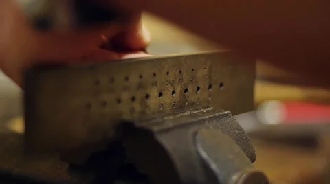 Craftman makes gold thread with his special tool Video stock 53897173