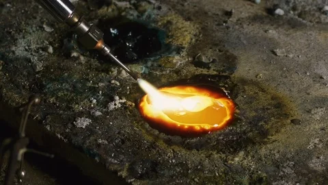 Craftman melts the silver with a flame Stock-Footage 82318170