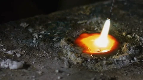 Craftman melts the silver with a flame Stock Footage 82318193