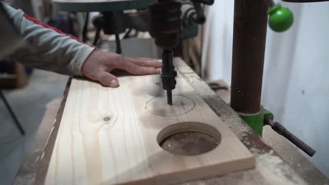 Craftman is working with a drill press Stock Footage 236896520