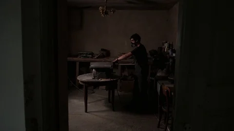 The craftman is working on electric saw machine. Sawing a large wooden board. Stock Footage 110338185