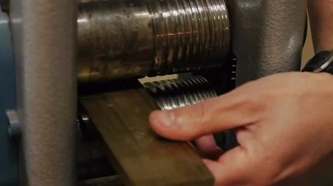 Craftman working a gold bar Video stock 53898291