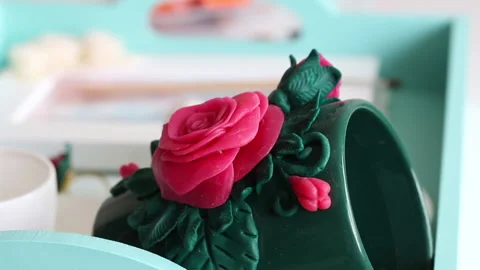 Crafts from polymer clay in different colors. Cups decorated with polymer cla Stock Footage 134565242