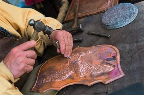 Craftsman affecting copper Stock Photos