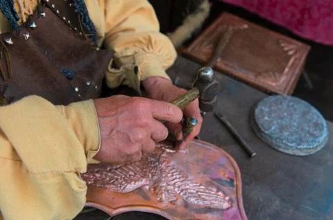 Craftsman affecting copper Stock Photos