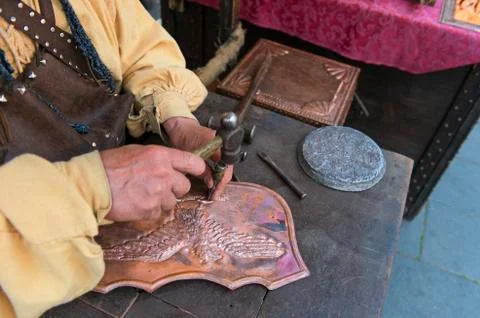Craftsman affecting copper Stock Photos