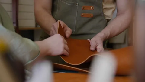 Craftsman and his Apprentice Testing their Working Material Leather Workshop Stock Footage 301676551