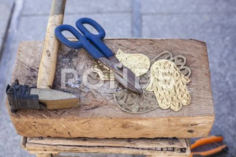 Craftsman bench with tools for engrave brass crafts Stock Photos