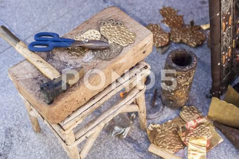 Craftsman bench with tools for engrave brass crafts Stock Photos