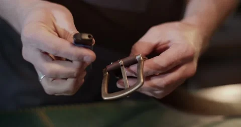 Craftsman burning thread on belt Video stock 172490570