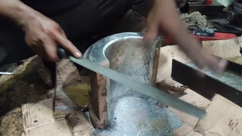 A craftsman carefully files the rough surface Stock Footage 260470065