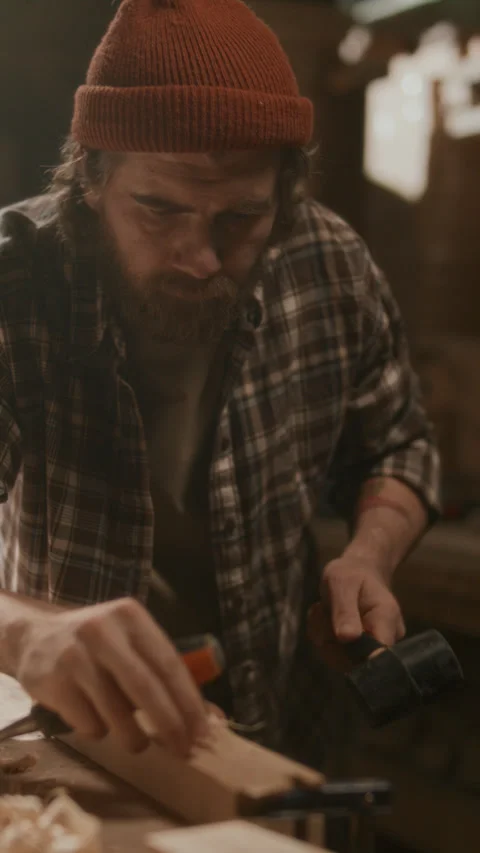 Craftsman Carving Timber with Chisel and Mallet in Carpentry Workshop Stock Footage 331982383
