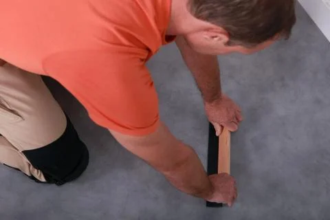 Craftsman changing the carpet Stock Photos