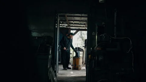 Craftsman cleaning anvil in the workshop Stock Footage 275450856