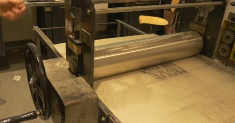 Craftsman Comes to an Old Fashioned Press Mashine and Rolls Its Steering Wheel, Stock Footage 53376572