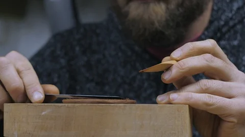 A craftsman cuts off an even circle of clay with a wooden knife to make a lid Stock Footage 120625967