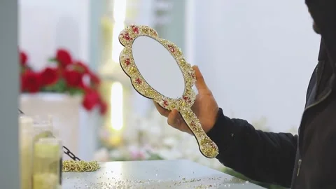 A craftsman decorates an elegant wedding mirror Stock Footage 326202618