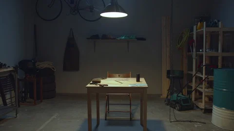 Craftsman enters the workshop and puts on an apron Stock Footage 127831536