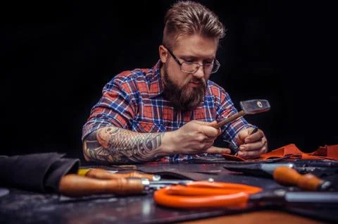 Craftsman focused on his work Stock Photos