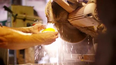 Craftsman Grinding Workpiece on Abrasive Wheel, Workshop Bench, Close Up Shot 動画素材 341338195