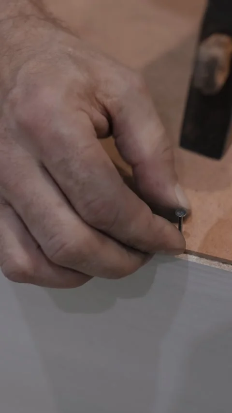 Craftsman hammering nail Video stock 303384932